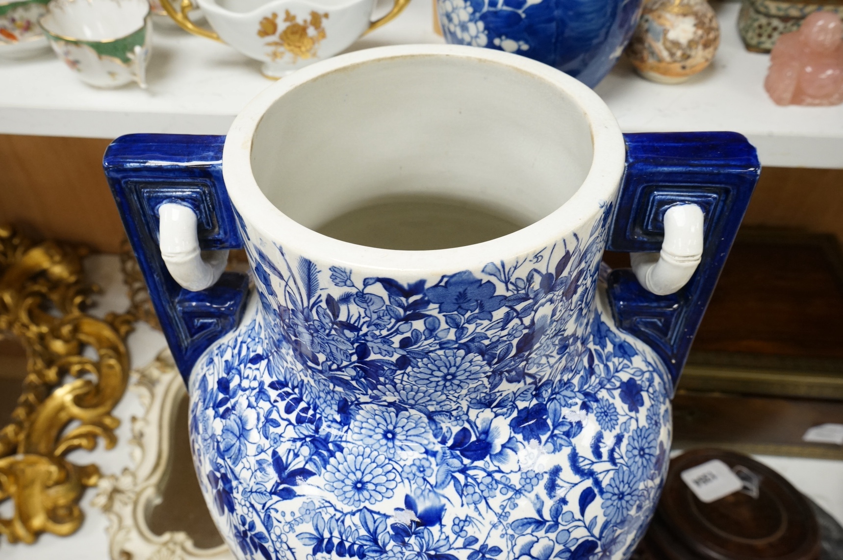 A large Victorian style blue and white vase with twin handles, 56cm high. Condition - star crack and crazing